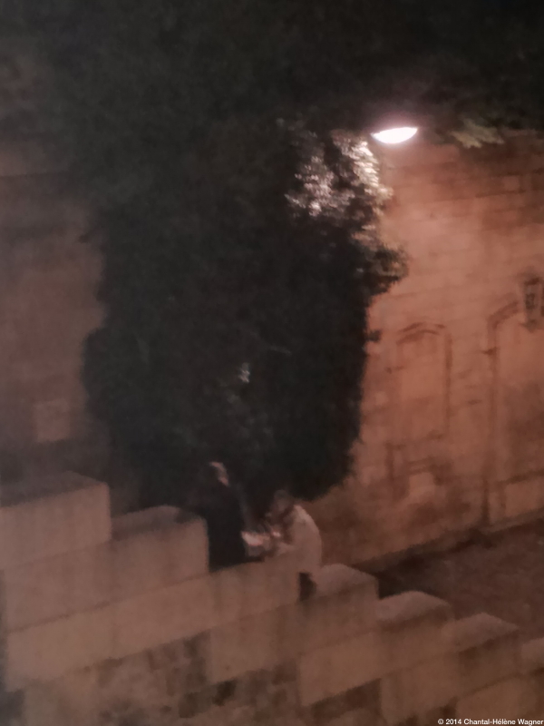 Talking_by_the_Seine_at_Night_Photo.jpg